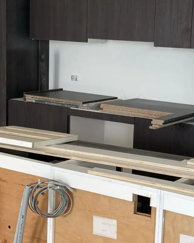 Kitchen cabinets during installation