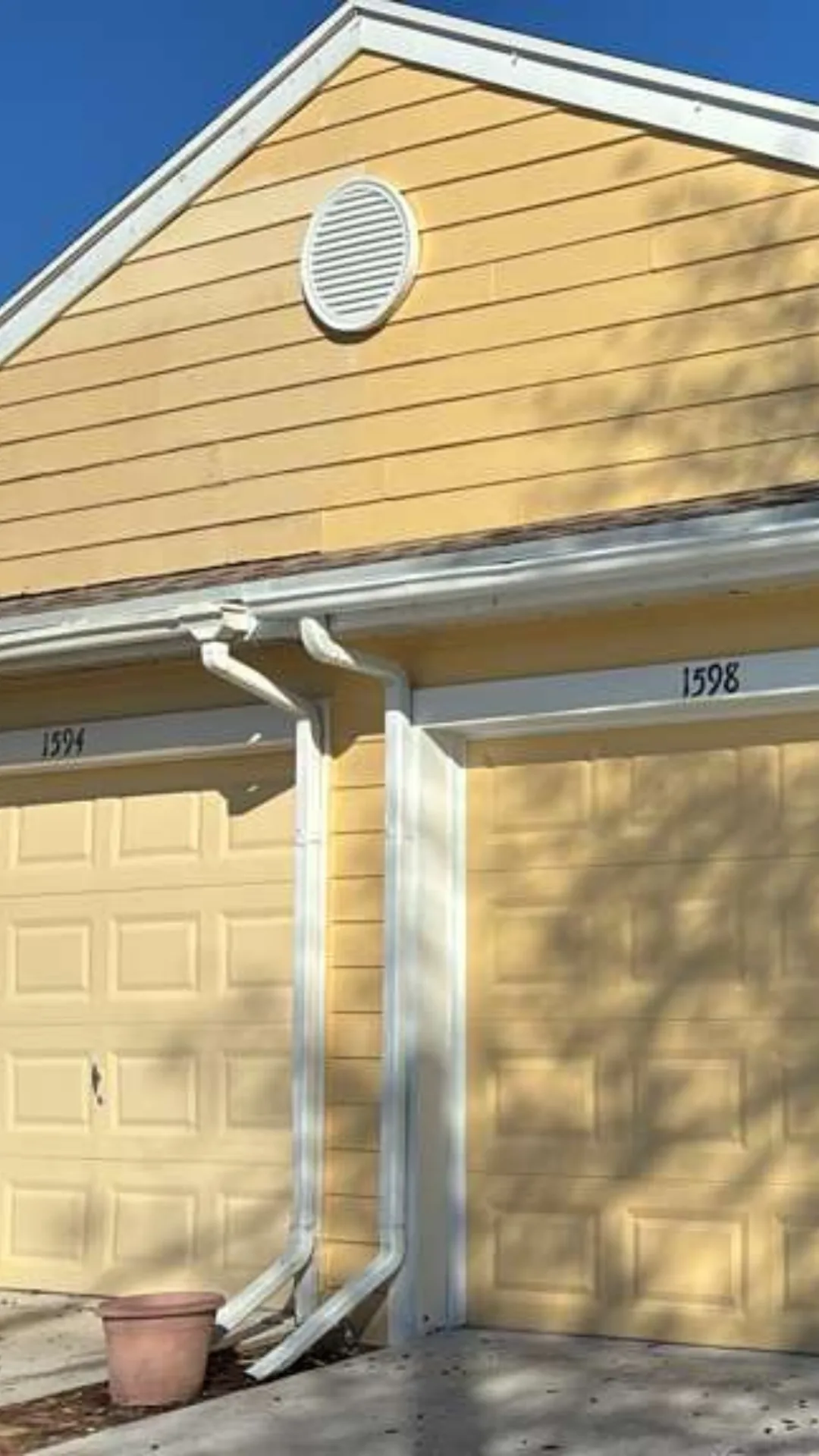 Exterior siding and trim work on a yellow house