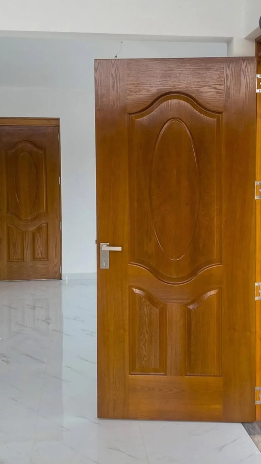 Wood-tone six-panel interior door