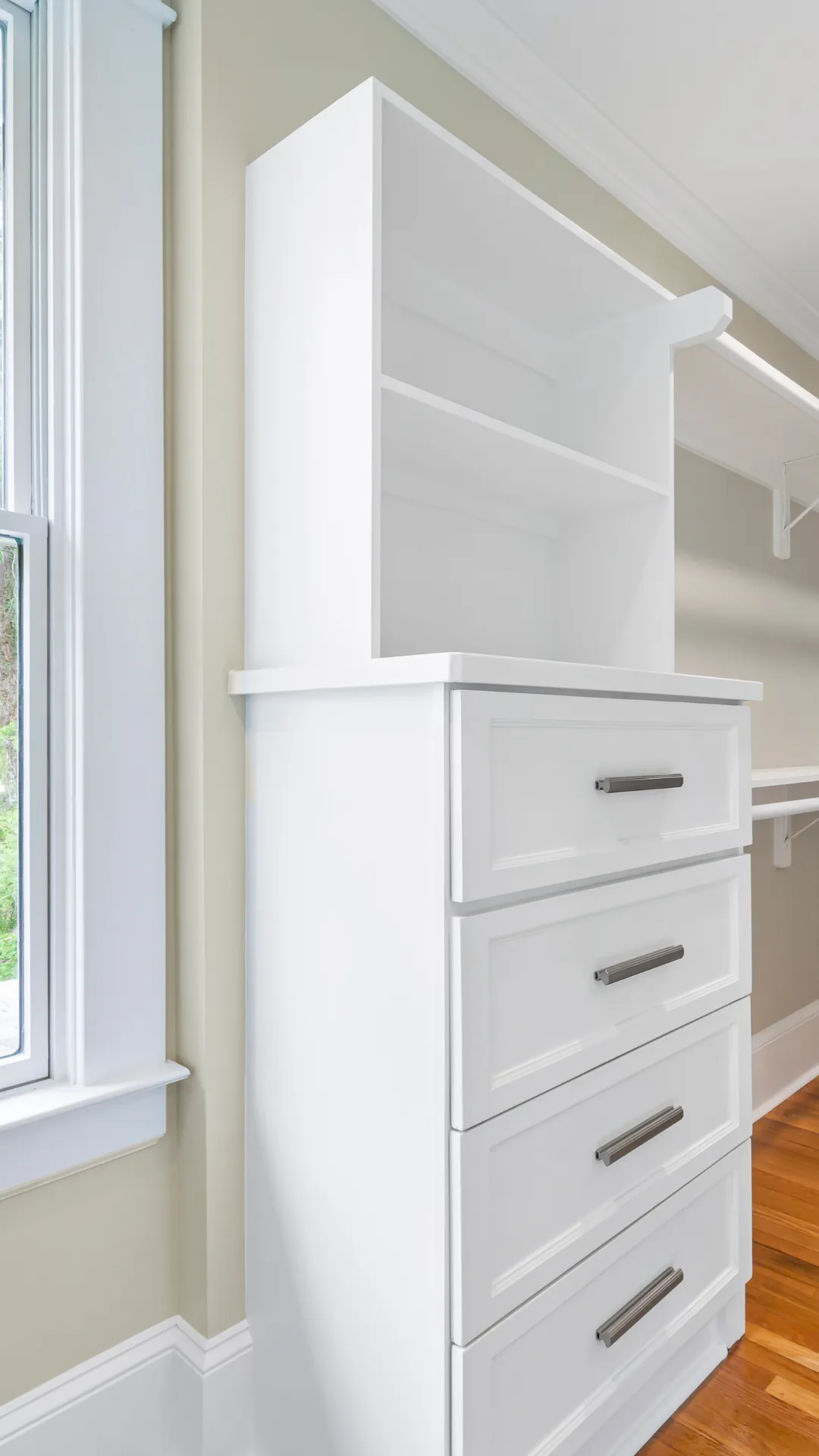 White built-in dresser with drawers and shelves